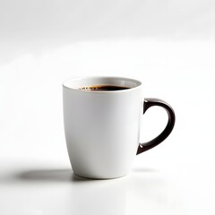 A simple white mug with rich black coffee sits on a pristine white surface in a minimalist presentation.