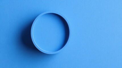 A circular cutout in a vibrant blue surface.