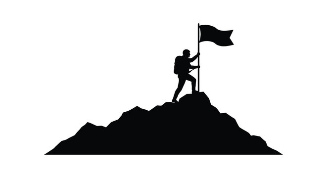 Man standing on mountain peak holding flag in victory