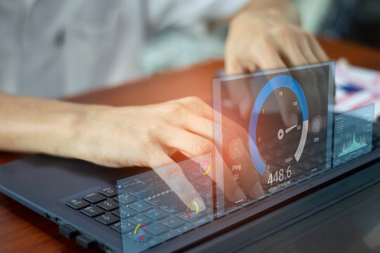 fast internet connection speedtest network bandwidth technology Man using high speed internet with smartphone and laptop computer. 5G quality, speed optimization.. - Powered by Adobe