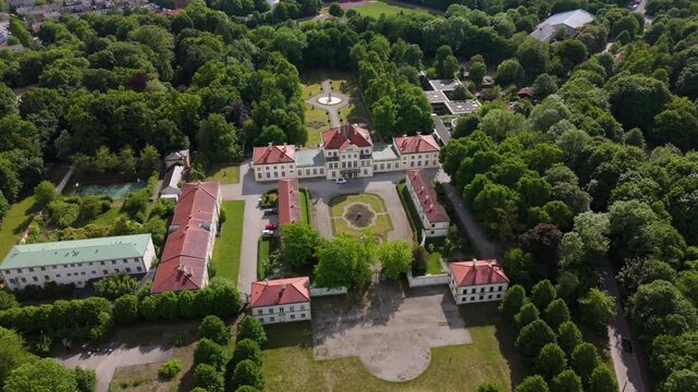 Drone footage of Fuerstenried Castle in southern Munich. Historic Baroque hunting lodge with symmetrical gardens and pastoral surroundings, ideal for cultural and travel themes. Schloss Furstenried. 