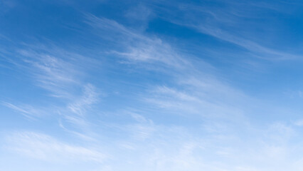 The sky is a vibrant, cloudless blue, while the sun shines brightly, making it appear even more radiant.