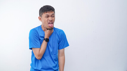 Asian young man touching his throat showing in pain expression