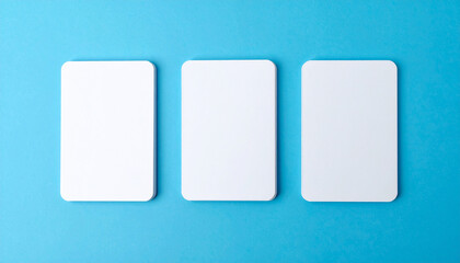 Three blank trading cards with rounded corners in a row on blue background. Isolated mockup