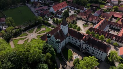 Schloss Alteglofsheim, Alteglofsheim, Bayern, Deutschland. Aerial drone view of historic castle now housing Bavarian Music Academy. Sunny summer day, park, panoramic landscape, cultural heritage