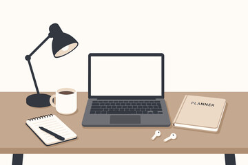 Workspace featuring a laptop, planner, coffee, and stationery arranged for productivity during a quiet afternoon