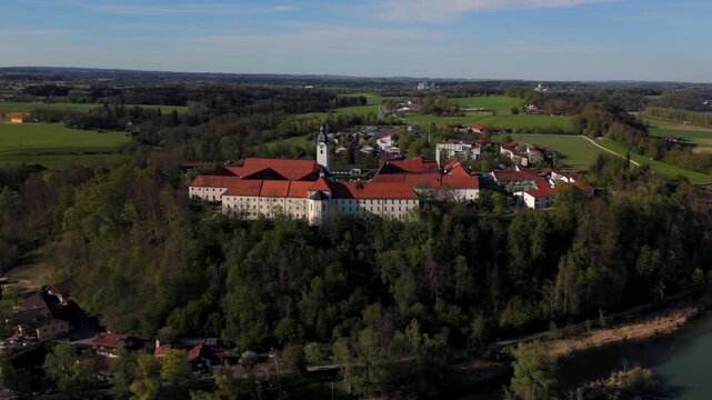 Aerial view Luftaufnahme of Attel Monastery and St. Michael Church on Attel Hill by Inn River, near Wasserburg am Inn, Bavaria. Historic Benedictine site, scenic spring landscape, rural Germany charm