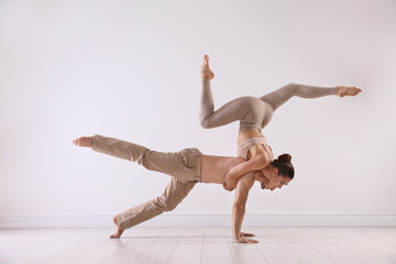 Couple of professional dancers training in studio