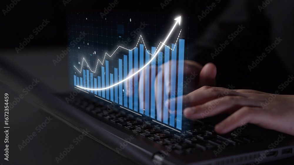 Poster hands on a laptop keyboard engage with digital data visualization, showcasing a rising graph that sy
