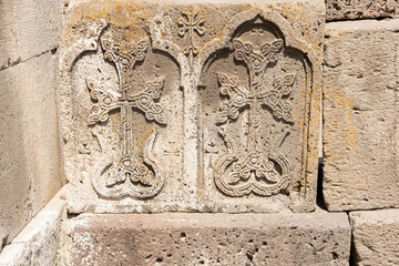 stone slabs with carved patterns in an ancient temple, Geghard, Armenia