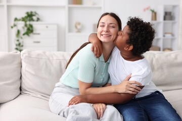 Adoption. Mother and her son at home