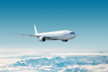 White wide body passenger airplane flying in the air over snow covered mountains