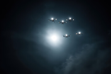 in dark night sky military drones patrol border invisibly projecting sense of dominance