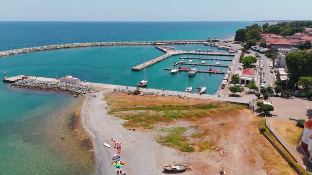 Aerial Drone Shot Flying Over Platamon Harbor And The Aegean Sea In Pieria, Central Macedonia, Greece On A Sunny Summer Afternoon.