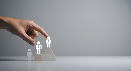 Gray, Minimalist Image Focuses on Hand Leading a Figure to Success. Good for Branding, Business Concepts, and Presentations.