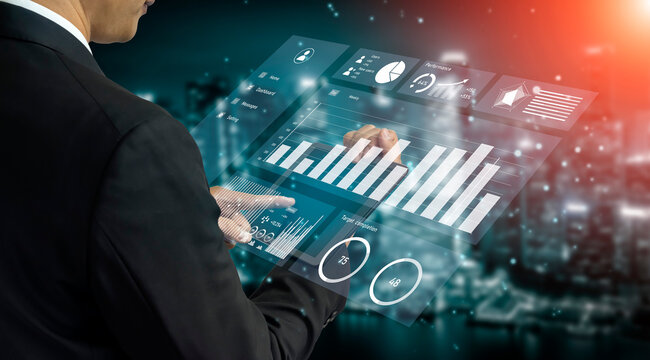 A business professional interacts with a digital analytics display, showcasing data insights and performance metrics in an urban nighttime setting. Impute