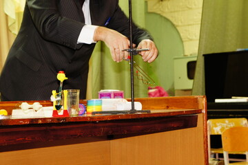 Interactive classroom physics setup with mechanical device and playful educational objects
