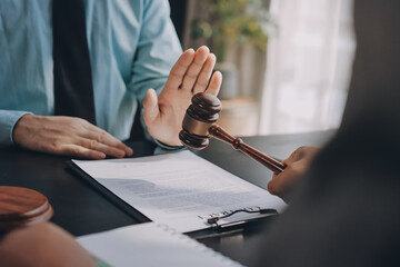 Lawyer explained to the client about the law that must be brought against the court case.