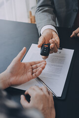 Car salesman gave the keys to the customers who signed the purchase contract legally, Successful...
