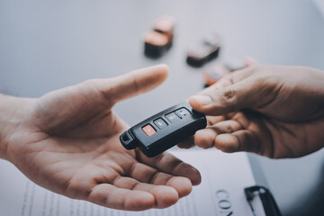 Car salesman gave the keys to the customers who signed the purchase contract legally, Successful...