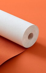 Fototapeta premium orange fabric with white paper roll mockup 