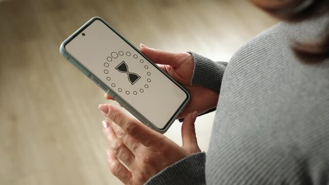 Girl With Smartphone Loading Process Waiting Then Holding It