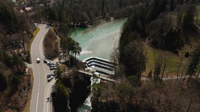 Aerial view of gorges, trail, viewing platform and waterfall on Lech River in Fussen, Germany. Landmark located on border with Austria. Lechfall Stauwehr am Lech Luftaufnahme, Fuessen, Deutschland. 