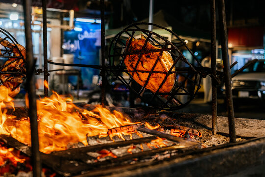 Traditional Iraqi Masgouf Fish Grilling Over Open Flames