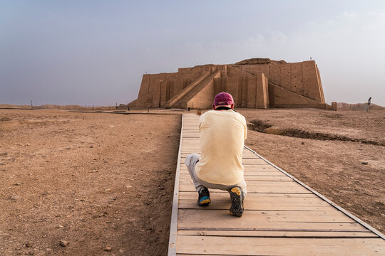Visitor capturing the historic Ziggurat of Ur in Iraq