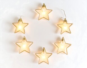 Fototapeta premium A circular arrangement of gold-framed star-shaped lights illuminates a plain white wall.