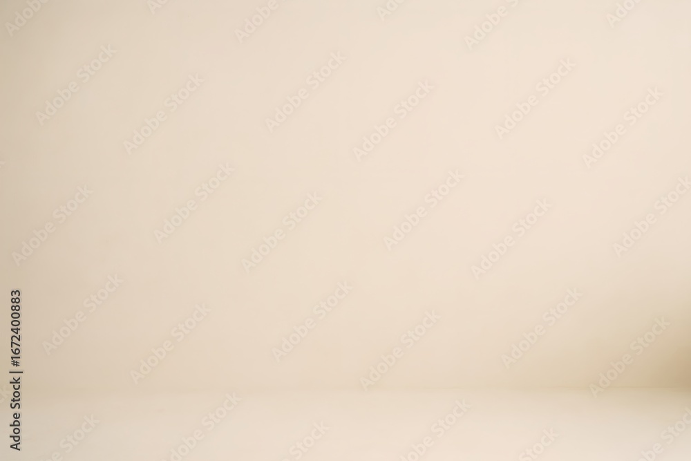 Poster empty beige studio background with a subtle shadow on the right side, perfect for product placement 