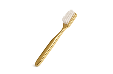 Luxury gold-plated toothbrush with white bristles isolated on black for premium oral care and hygiene concepts on transparent background