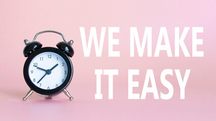 We make it easy symbol. Beautiful pink background with alarm clock with words We make it easy....
