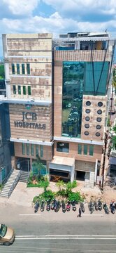 Dindigul, Tamilnadu, india - June 25, 2023: Exterior view of JCB hospital building with wheelchair accessible entrance, underground parking. The facility represents regional healthcare infrastructure