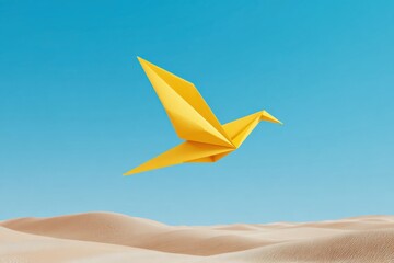 Yellow origami bird flying over desert landscape under blue sky