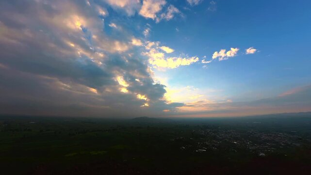 Clouds moving over cholula city during golden hour