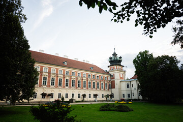 Historic palace with manicured gardens in Lancut, Poland on a sunny day