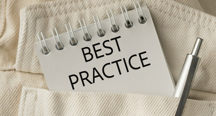 A pen is sitting on top of a notebook that says Best Practice