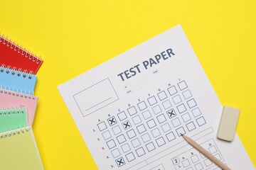 Answer sheet, pencil and eraser and notebooks on yellow background, flat lay. Student passing exam