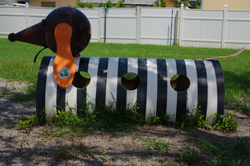 Colorful Dog Animal Playground Structure in Green Outdoor Environment Black and White stripes....