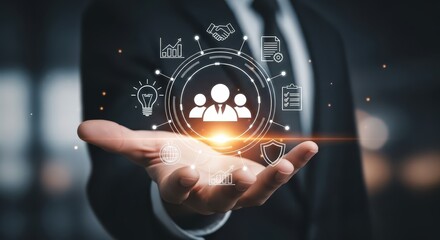 Business professional holding a digital interface with human resource icons