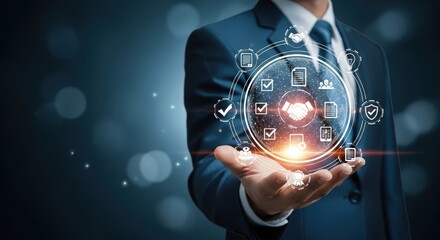 Businessman holding a digital interface with business process icons