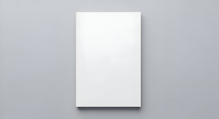 Fototapeta premium Minimalist White Book Cover Mockup on a Soft Gray Background.