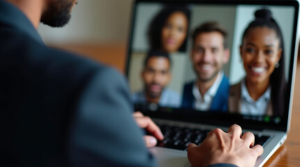 Diverse group of people in a video conference call on a laptop screen with blurred foreground