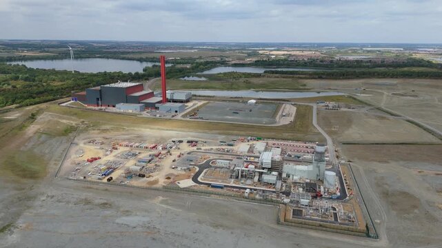 Aerial drone view of Millbrook and Rookery industrial power plant, energy generation from gas and oil, smoke stacks, Bedford England UK
