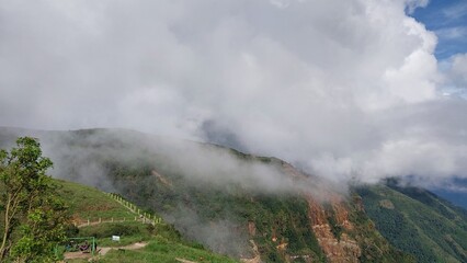 mountain landscape covering with fog.
