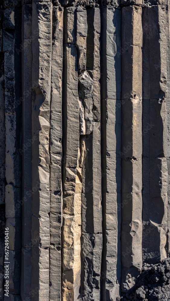 Poster aerial view of striking basalt columns showing geometric rock formations