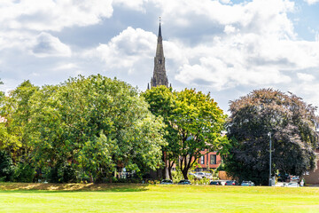 A view across the green beside Stowe pool in Lichfield, UK in summertime