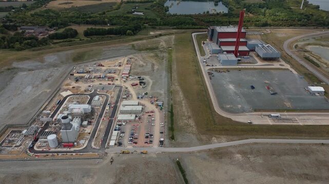 Aerial drone view of Millbrook and Rookery industrial power plant, energy generation from gas and oil, smoke stacks, Bedford England UK