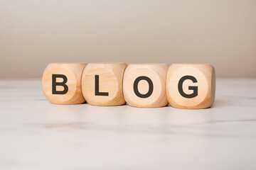 Wooden cubes with word BLOG symbolizing blogging, online writing, digital media and content creation